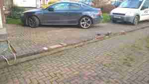 Image of ab Uneven and tired driveway