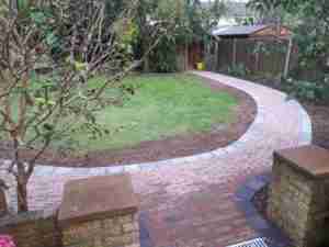 Image of new curving path to shed with new bed to side