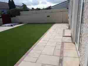 Image of New Cheisa paving and steps into house with artificial lawn 