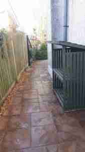 Image of new paving to side of house with gravel border for drainage