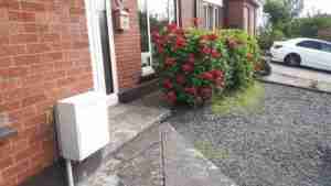 Image of concrete path and bed to front of house