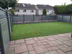 Image of Elite fence, a low maintenance fence , Artificial lawn and Connemara walling raised bed