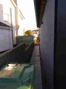 Side alley with grey block walls