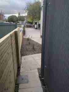 New contemporary timber clad side alley with grey block walls