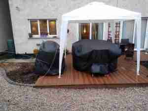Image of tired decking and bed