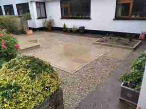 Yellow limestone patio with gravel surround