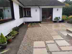 Yellow limestone patio with gravel surround