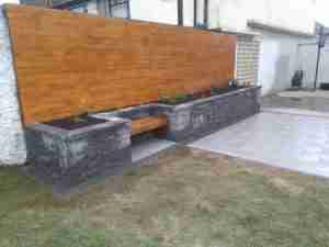 Image of raised bed and timber larch cladding, new silver granite patio