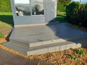 Composite decking with lights and gravel surround & plants