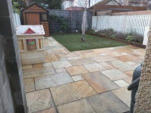 View down garden of paving and lawn