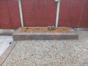 Retaining wall & bed with cottage style perennials